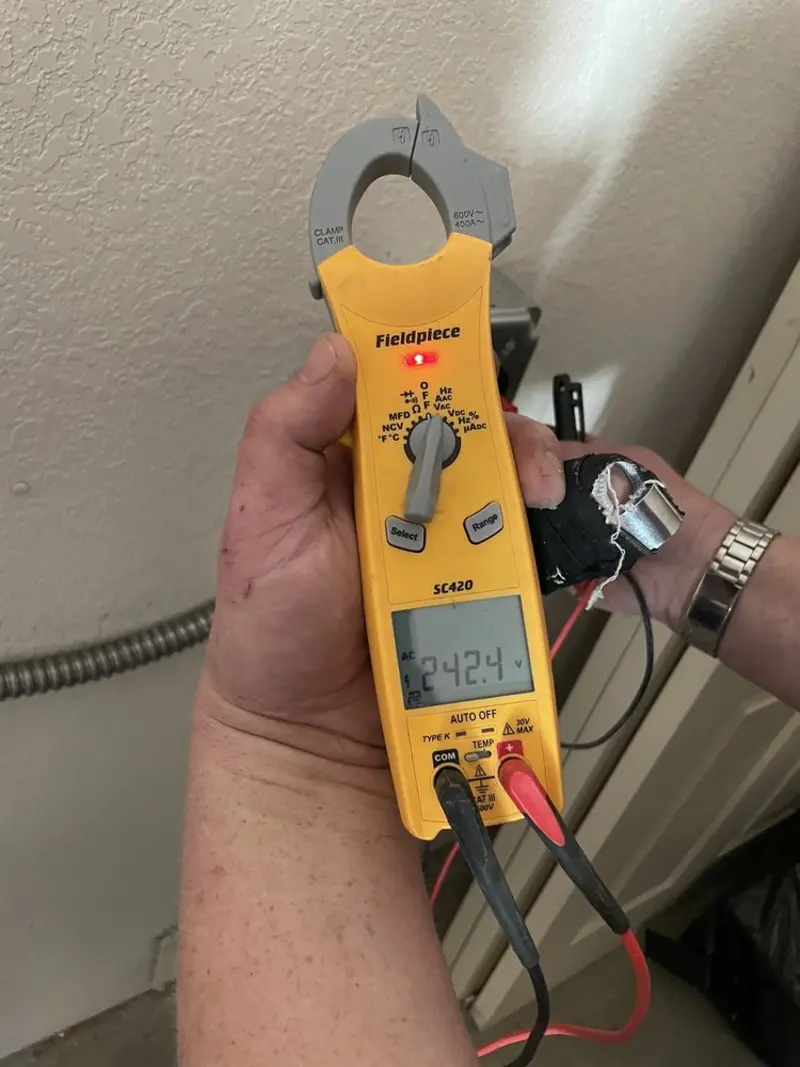 Voltage testing with clamp meter during Recessed Lighting Installation in Sinton
